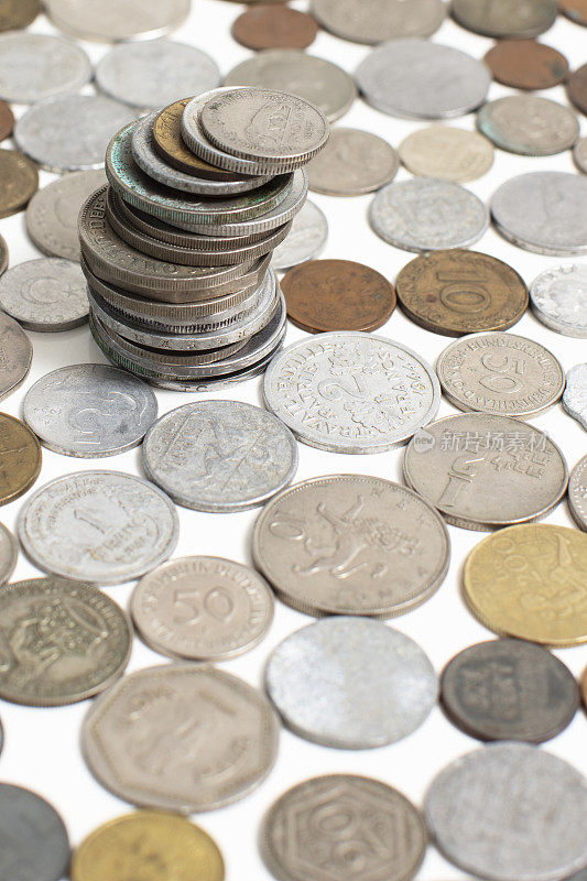 Closeup of a lot of coins money from different countries of the world.